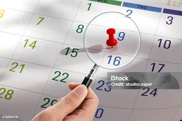 Magnifying Glass On A Calendar Stock Photo - Download Image Now - Blue, Calendar, Calendar Date