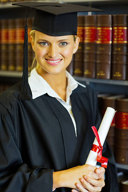 istock female graduate in university library 476505643