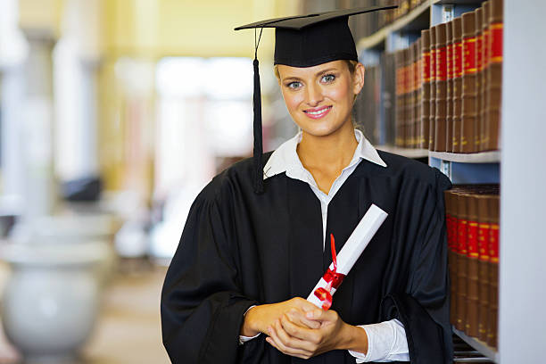 pretty female graduate in library
