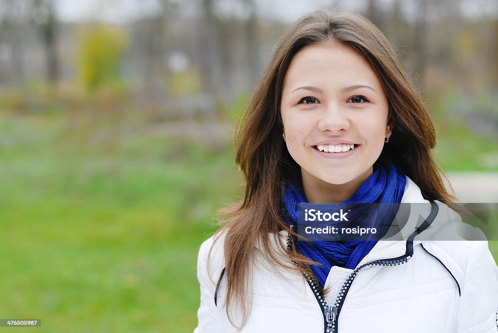 portrait of beautiful young teen brunette girl happy smiling portrait of beautiful happy smiling young brunette woman on the outdoors background Adult Stock Photo