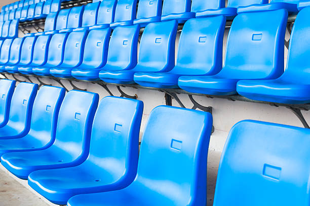istock Empty dark blue chairs at the football Stadium 476506127