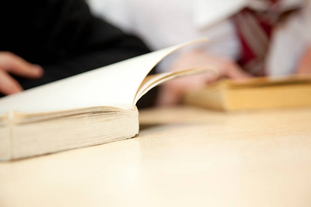 istock children reading in school - no faces 476508961