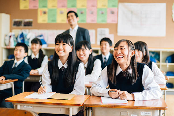 Funny Class Presentation Japanese Junior High School students laughing at a funny presentation or performance in class comedian photos stock pictures, royalty-free photos & images