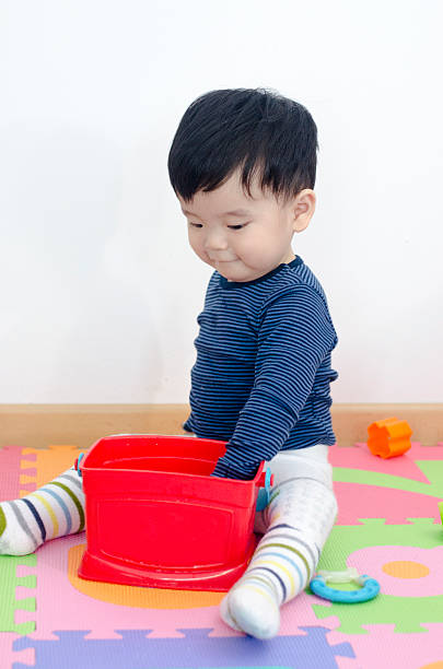 istock Asian Baby Boy playing with Toy 476509936