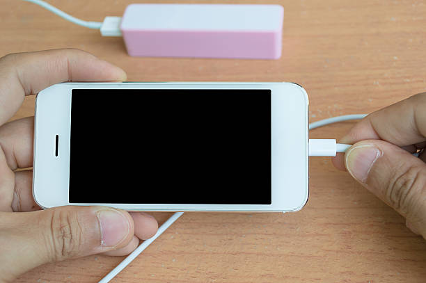 istock Phone charger with power bank on desk 476512024