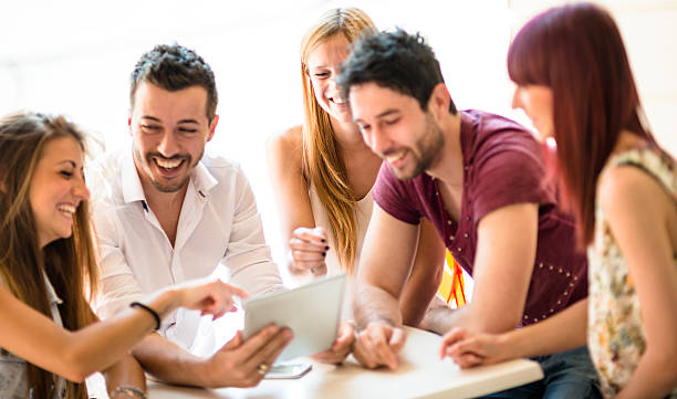 istock Group of people enjoying with a tablet 476512060
