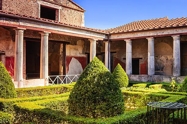 A Villa in Pompeii, Italy.  The whole city was completely destroyed by the last great erruption of Mount Vesuvius in 79 AD. This elegant villa gives visitors an idea of how the people of Pompeii lived almost 2000 years ago.  Photo shot in the afternoon sunlight; horizontal format.  Copy space. No poeple.