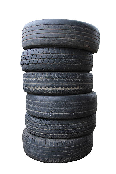 istock stack of worn out rubber tire isolated against white. 476518702