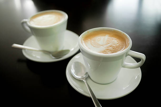 istock Two white cups of cappuccino 476518998