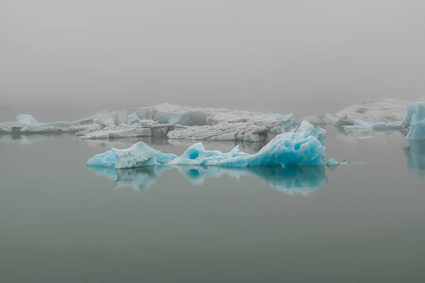 A the mighty glacier is shrouded on a misty day at Jokulsarlon ice lagoon, Iceland.