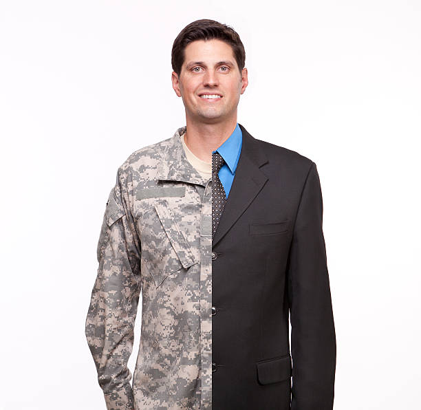 hombre joven con dos carreras ejecutivo y soldado - military uniform fotografías e imágenes de stock