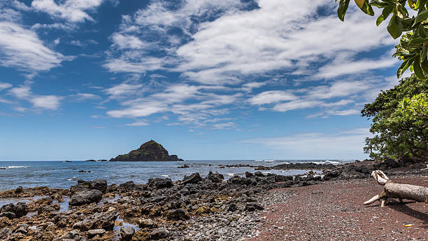 Hana Bay This area is well protected and is usually a very safe place to swim. Hana Bay is a place where local residents gather during the weekend. It is also the perfect spot for picnics and water activities . hana coast stock pictures, royalty-free photos & images