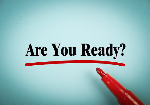 Are You Ready text is written on blue paper with a red marker aside.