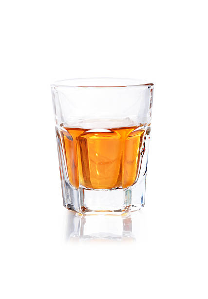 istock Whiskey in a shot glass isolated on a white background 476524164