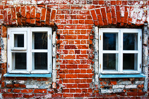 red brick wall with windows