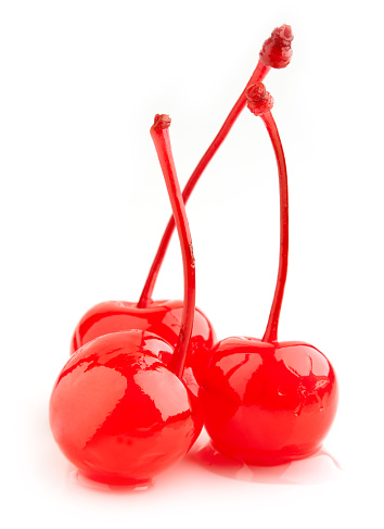 red maraschino cherries isolated on white background