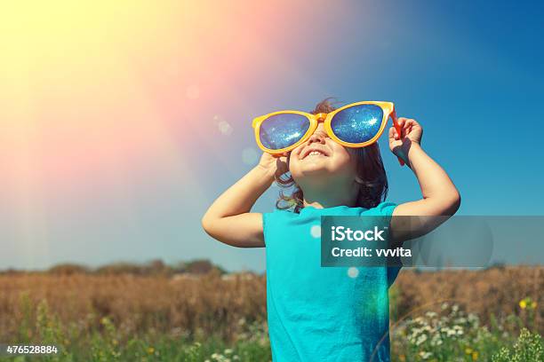 Little Girl With Big Sunglasses Enjoys Sun Stock Photo - Download Image Now - Child, Large, Sunglasses