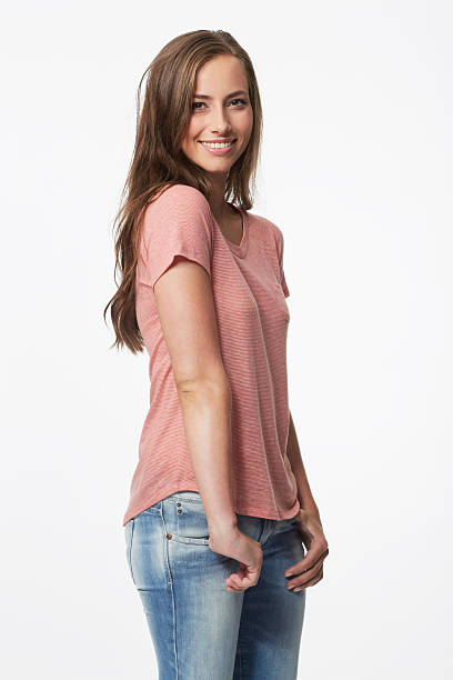 istock Portrait of young woman in studio, smiling 476529749