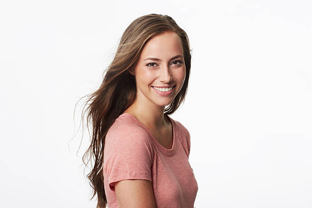 istock Portrait of young woman in studio, smiling 476530967