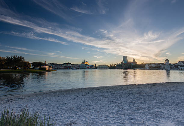 Boardwalk Disney  area with Swan and Dolphin hotel Orlando, FL, USA - January 15, 2012: Boardwalk Disney  area with Swan and Dolphin hotel on Crescent Lake shore at sunset in Orlando on January 15, 2012. disney world stock pictures, royalty-free photos & images