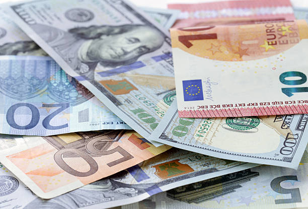 istock Money background - US dollars and euro banknotes 476532690