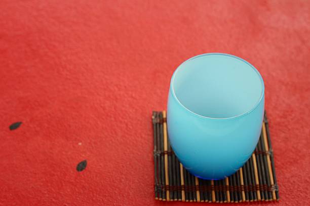 istock Water in a glass on a red background 476534178