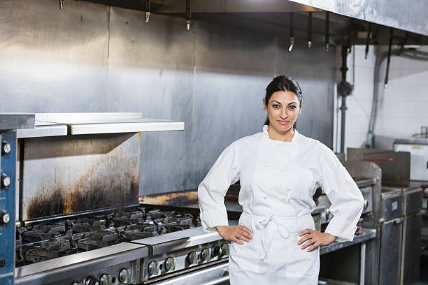 istock Female chef in a commercial kitchen 476540366