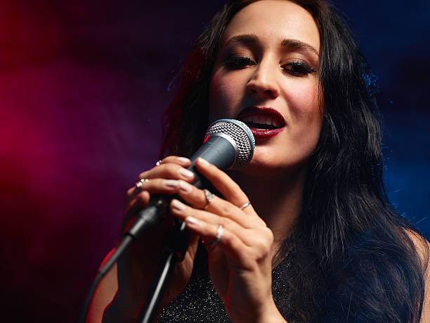 istock Beautiful woman sings 476542776