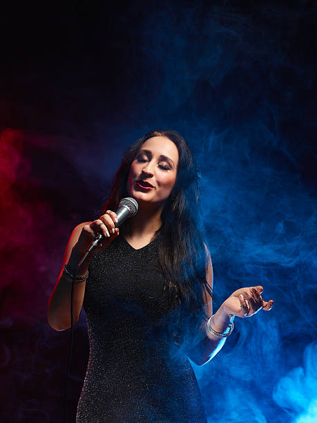 istock Beautiful woman sings 476542788