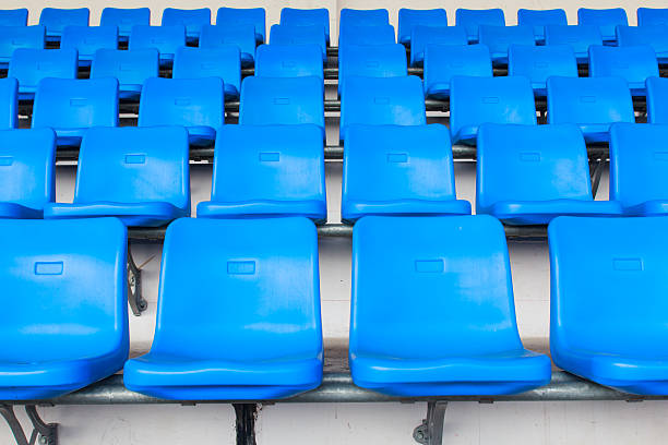 istock Empty dark blue chairs at the football Stadium 476545421