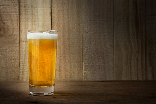 istock Beer Glass on a Wooden Background 476546444