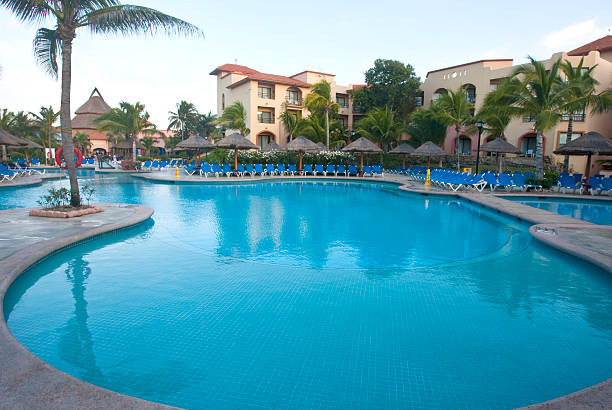 istock Beautiful pool and patio in tropical setting 476547263