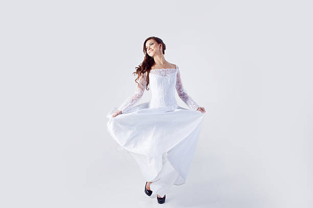 istock Beautiful bride in wedding dress, white background 476547582