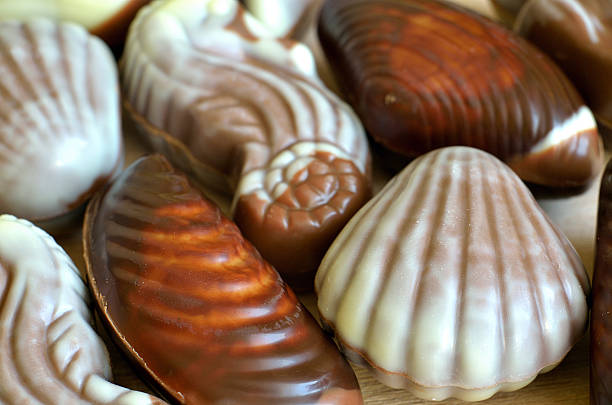 istock Chocolate candies shaped like seashell and seahorse 476547632