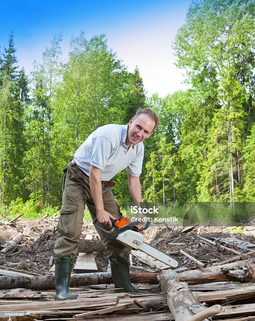 The Surprised Man With A Chain Saw In Summer Wood Stock Photo ...