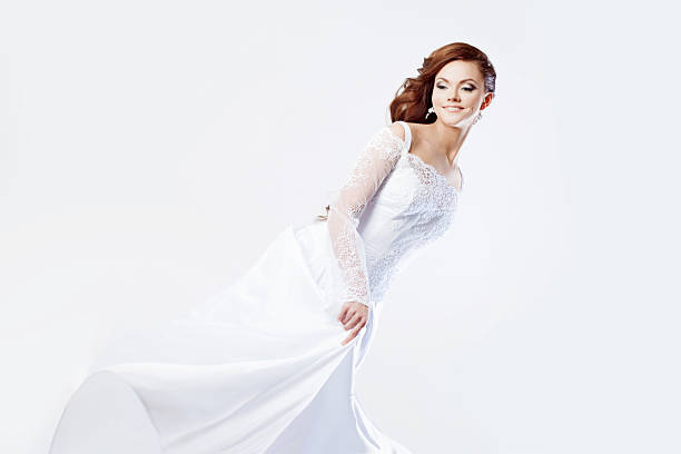 istock Beautiful bride in wedding dress, white background 476548760
