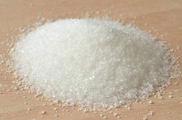 istock Heap of white granulated crystal sugar 476549150
