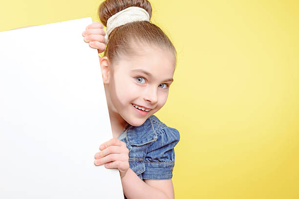 istock Small girl holding a copy space 476552968