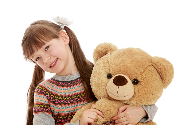 istock Charming girl with tails hugging a Teddy bear 476557684