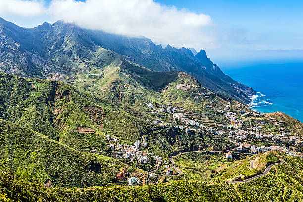istock Mountain and clouds with small city or village 476559722