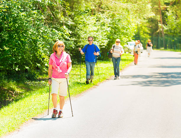 istock Nordic walking in park 476561303