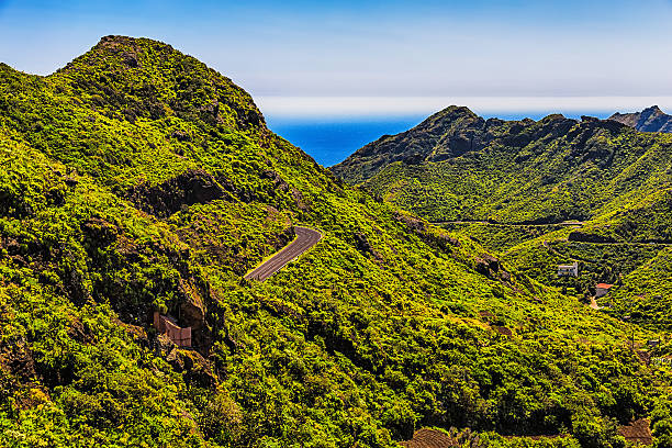 istock Green mountains or rocks with winding road 476562552