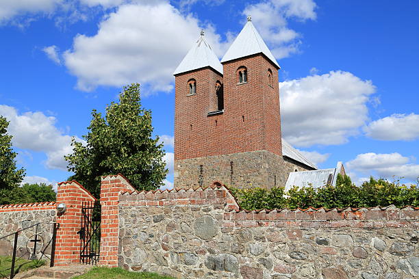Fjenneslev medieval parish church on Zealand has a central position in the history of Denmark. The myth tells, that Asser Rig, a noble man, had to leave his pregnant wife to go to war. They made the deal, that if she gave birth to a boy, she should build a tower, and if she gave birth to a girl a spire. Asser Rig came home to a church with a double tower representing the boys Absalon and Esbern Snare. 