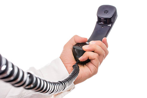 istock holding the black phone receiver at a distance 476568701