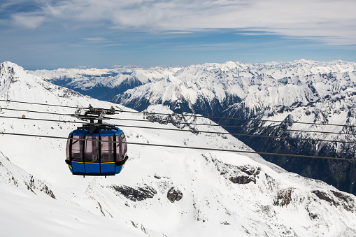 Cable car with ski slope in mountains near Zillertaler Alps