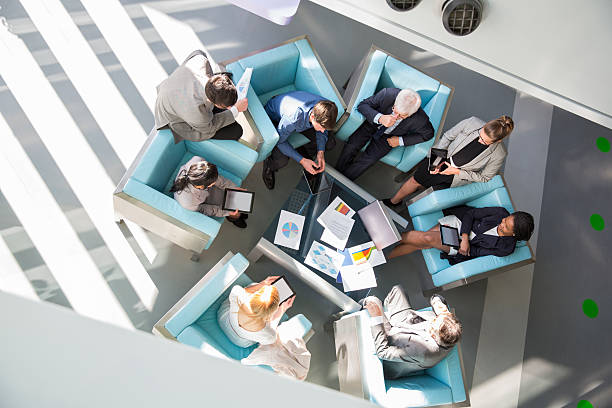 istock Group of ofiice worker sitting in lobby,discussing 476569924