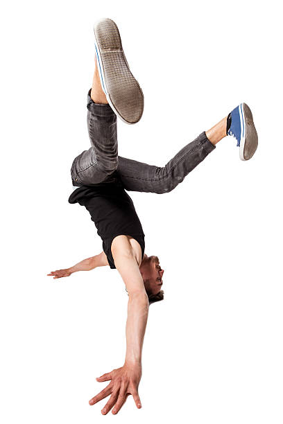 istock Break dancer doing one handed handstand against a white background 476574724