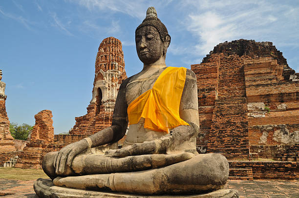 istock Buddha statue sit in Ayutthaya Thailand blue sky 476575112