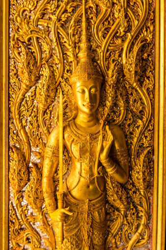 thai style art carving at the door of temple.