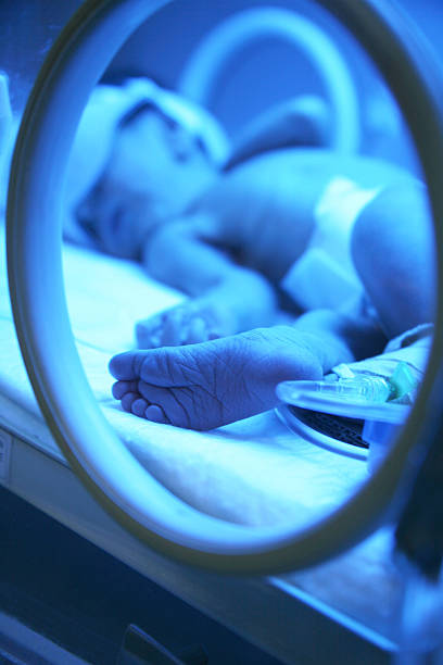 istock Newborn baby lying in hospital incubator 476576287